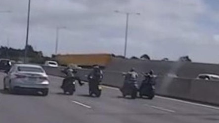 A Mongols OMCG bikie member kicks at the L-plate rider on the Monash Freeway. Picture: Victoria Police