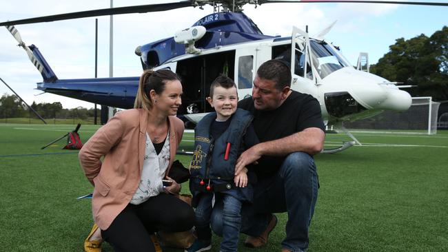 Rocco Moy along side his parents Alecia and Scott. Picture: Tim Hunter