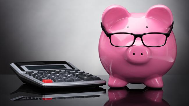 Close-up Of Pink Piggy Bank And Calculator On Grey Background; superannuation saving generic