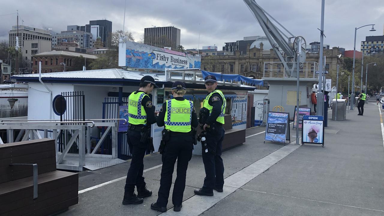 Tasmania Police officers searching Hobart’s waterfront for a man who fled Hobart Magistrates Court this afternoon.