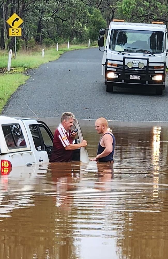 A 4WD partially submerged in floodwaters at Stewart Valley Rd, Goodger, after its driver tried to cross the flooded road as the South Burnett was inundated for a second day. Picture: Tammie Scholl, Facebook.