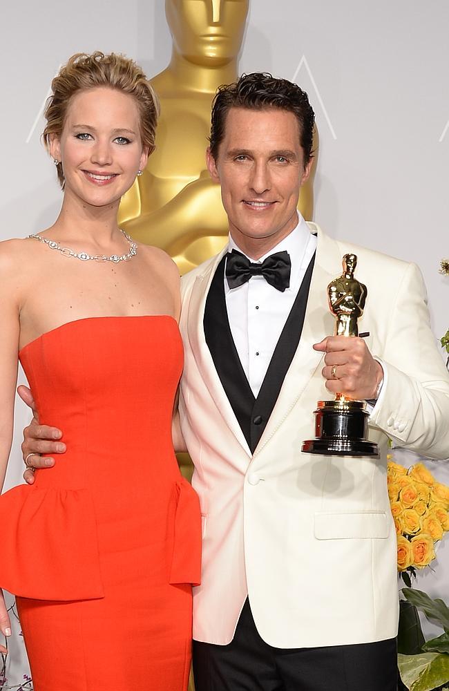 Actors Jennifer Lawrence (L) and Matthew McConaughey, winner of Best Performance by an Actor in a Leading Role pose in the press room during the Oscars at Loews Hollywood Hotel on March 2, 2014 in Hollywood, California. (Photo by Jason Merritt/Getty Images)