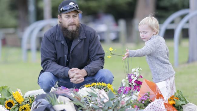 Members of the public leave flowers at a makeshift memorial to Eurydice Dixon. (Pic: Wayne Taylor)