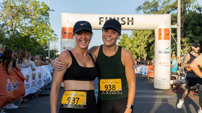 Katie Woolf and Natasha Fyles crosses the finish line at the 2025 edition of the annual NT City2Surf, Sunday, June 1. Picture: Pema Tamang Pakhrin