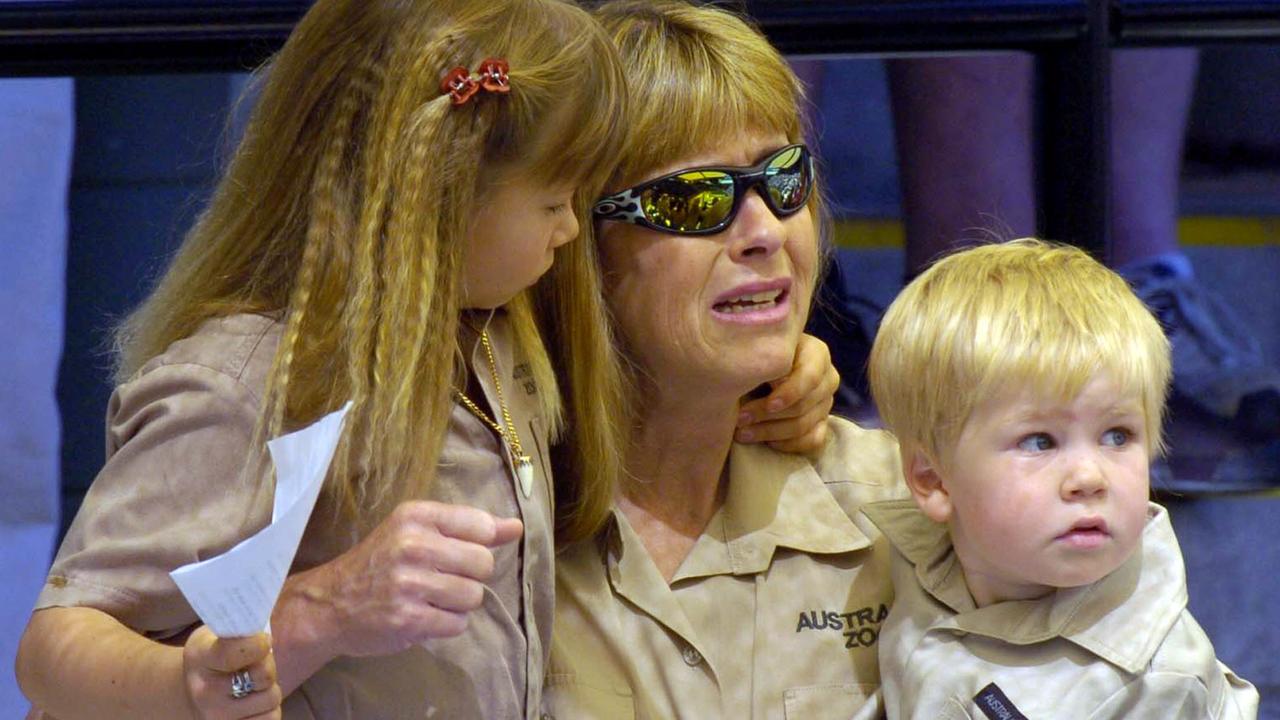 Terri Irwin sits with Bindi and Robert at a memorial service for her husband at Australia Zoo.