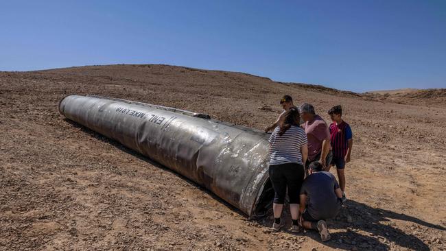 Israelis visit the site of an Iranian missile in the Negev desert. Picture: AFP.