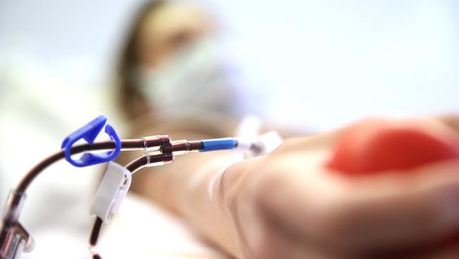 A recovered German COVID-19 patient donates blood plasma for research last month. Picture: Getty Images