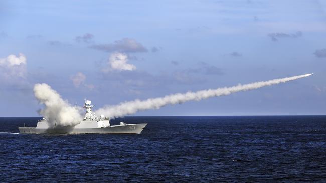 Chinese missile frigate Yuncheng launches an anti-ship missile during a military exercise in the waters near south China's Hainan Island. Picture: AP