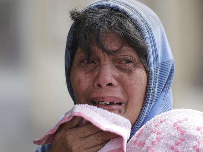 A woman cries over her missing husband who she has not seen since they evacuated their homes near the Taal volcano. Picture: AP