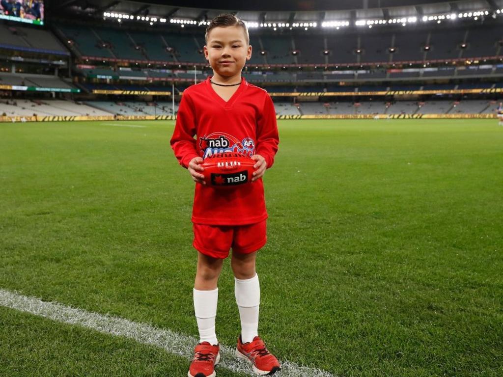 Jaguar Bogert, 6, was named Auskicker of the Week in round eight and will present a premiership medal to a player from the winning team on Grand Final Day. Picture: AFL Photos