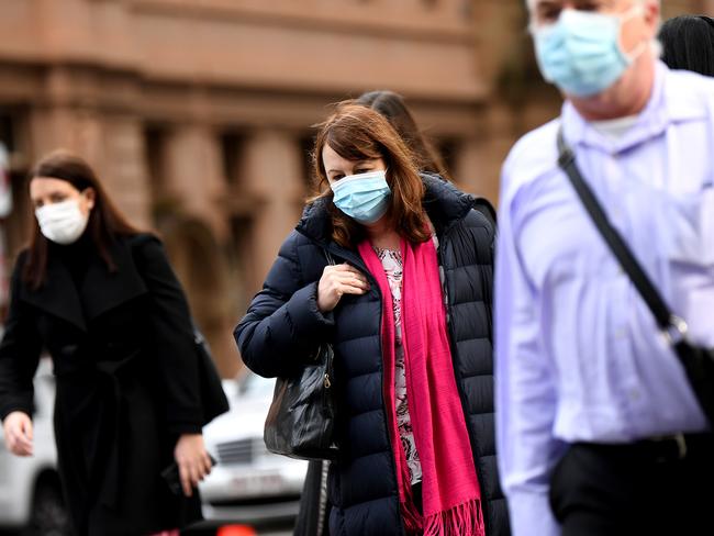 BRISBANE, AUSTRALIA - NewsWire Photos - JULY 6, 2021.Masked pedestrians make their way through central Brisbane during the morning rush hour. QueenslandÃs recent lockdown has ended but some restrictions, including wearing masks in public, remain.Picture: NCA NewsWire / Dan Peled