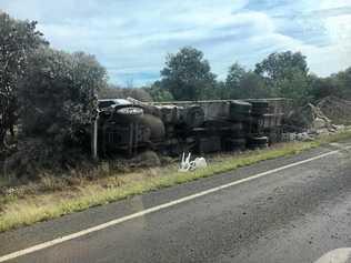 The truck overturned just off of the Warrego Hwy.