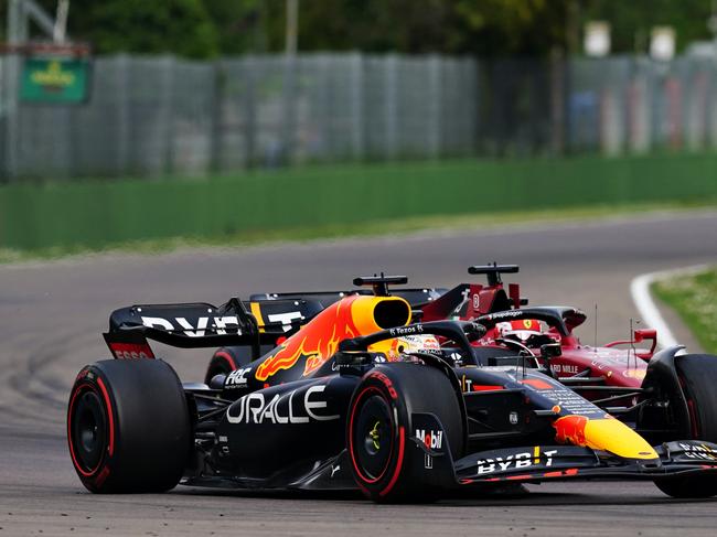 IMOLA, ITALY - APRIL 23: Max Verstappen of the Netherlands driving the (1) Oracle Red Bull Racing RB18 overtakes Charles Leclerc of Monaco driving (16) the Ferrari F1-75 for the lead during Sprint ahead of the F1 Grand Prix of Emilia Romagna at Autodromo Enzo e Dino Ferrari on April 23, 2022 in Imola, Italy. (Photo by Getty Images/Getty Images)