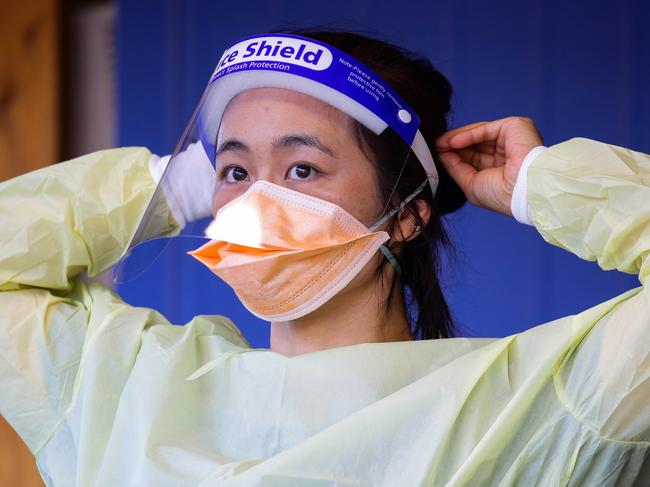 SYDNEY, AUSTRALIA - NewsWire Photos APRIL 05, 2021:  A nurse is seen adjusting her protective face mask while working at the Covid Testing Clinic at the Royal North Shore Hospital on Easter Monday afternoon in Sydney, Australia. Picture: NCA NewsWire / Gaye Gerard