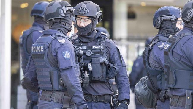 Police break up anti-lockdown protesters outside Northcote Plaza today. Picture: Wayne Taylor