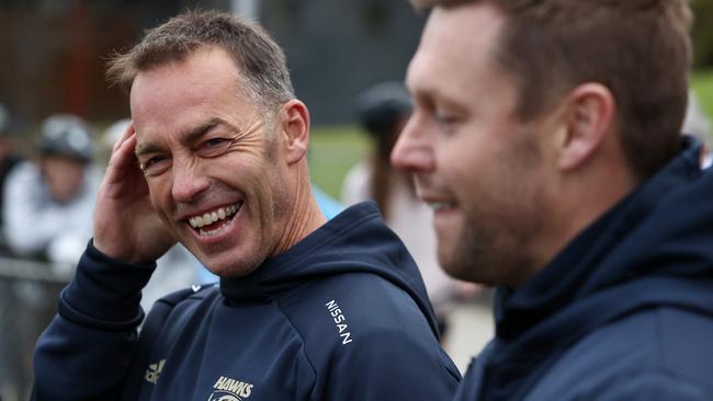 Clarkson and Mitchell share a laugh after the four-time premiership coach announced would step aside of the end of the season. Picture: Michael Klein