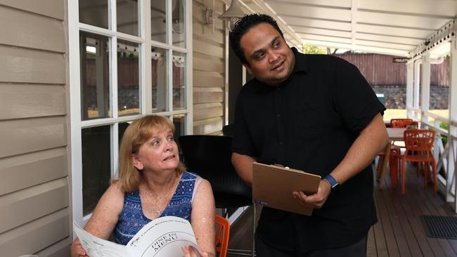 Redlynch resident Denise Kilpatrick and owner of Coconuts restaurant in Redlynch Valley Ravi Perera listen as the Copperlode Falls Dam early warning sirens are being tested PICTURE: ANNA ROGERS