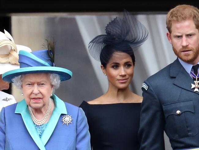 Royal author Gyles Brandreth says the Queen, with Meghan Markle and Prince Harry, was always able to take “the possibility of being in the firing line in her stride”. Picture: Getty Images