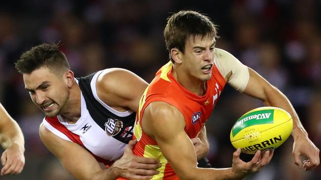 Jarryd Lyons gets a handball away during his impressive first season for the Suns. Picture Scott Barbour/AFL Media/Getty Images