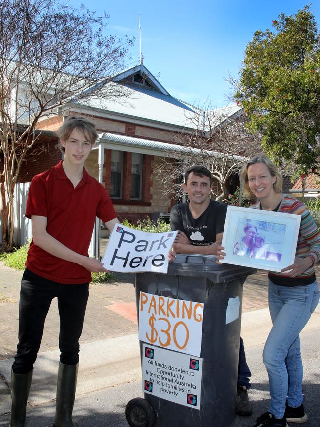 David and Anthony Perry and Kirsty Munro offer parking space at their home near the Showgrounds, to raise money for a charity. Picture: Dean Martin