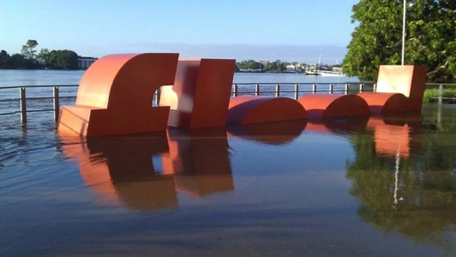 Richard Tipping's "flood'' sign outside the Powerhouse during the 2011 flood. It marks the high point of the 1974 flood.