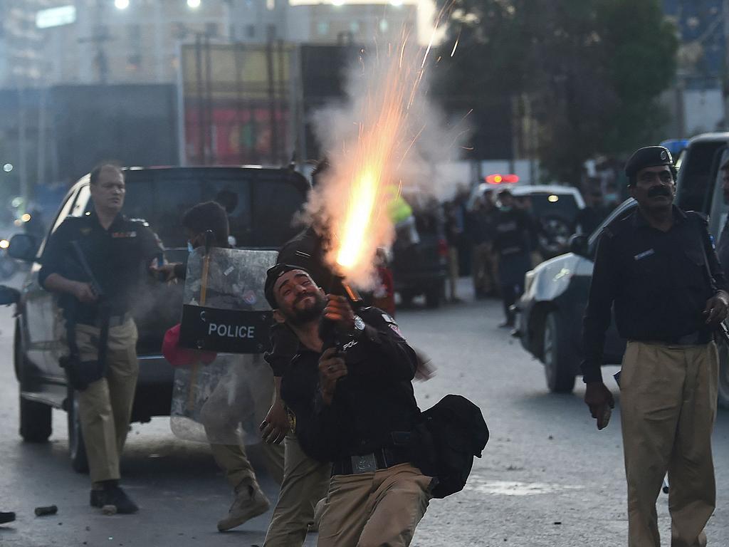 Police fire tear gas shells at protesters in Karachi. Picture: Asif Hassan/AFP