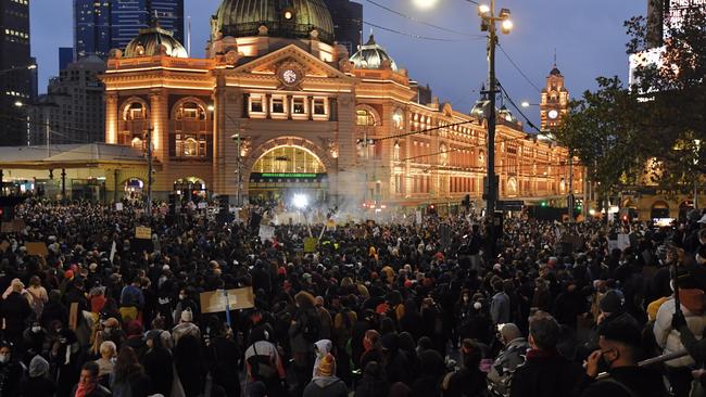 Crowds gather at Flinders St station. Picture: Jason Edwards