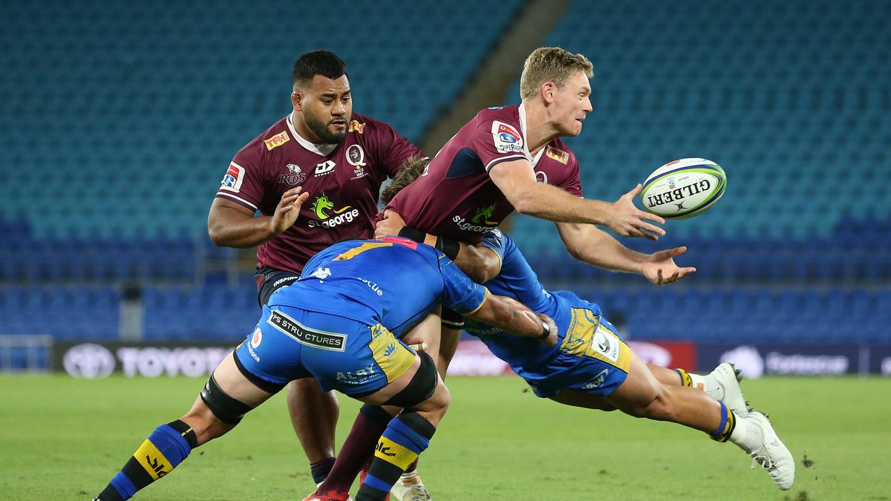 The Reds’ Bryce Hegarty gets a pass away in his side’s big win over Western Force. Picture: Chris Hyde/Getty Images