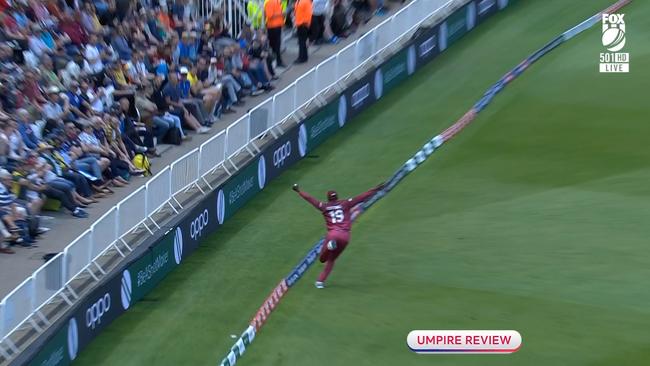 West Indies' Sheldon Cottrell takes a spectacular catch to dismiss Steve Smith.