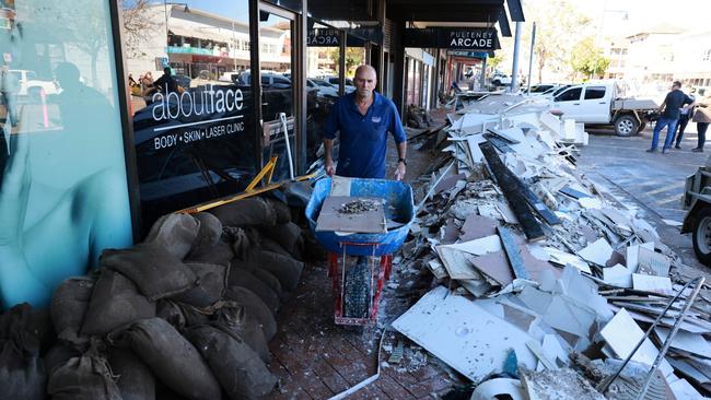 Flood-affected communities are beginning to mop up the damage after heavy rainfall and flooding. Picture: Scott Calvin/NewsWire