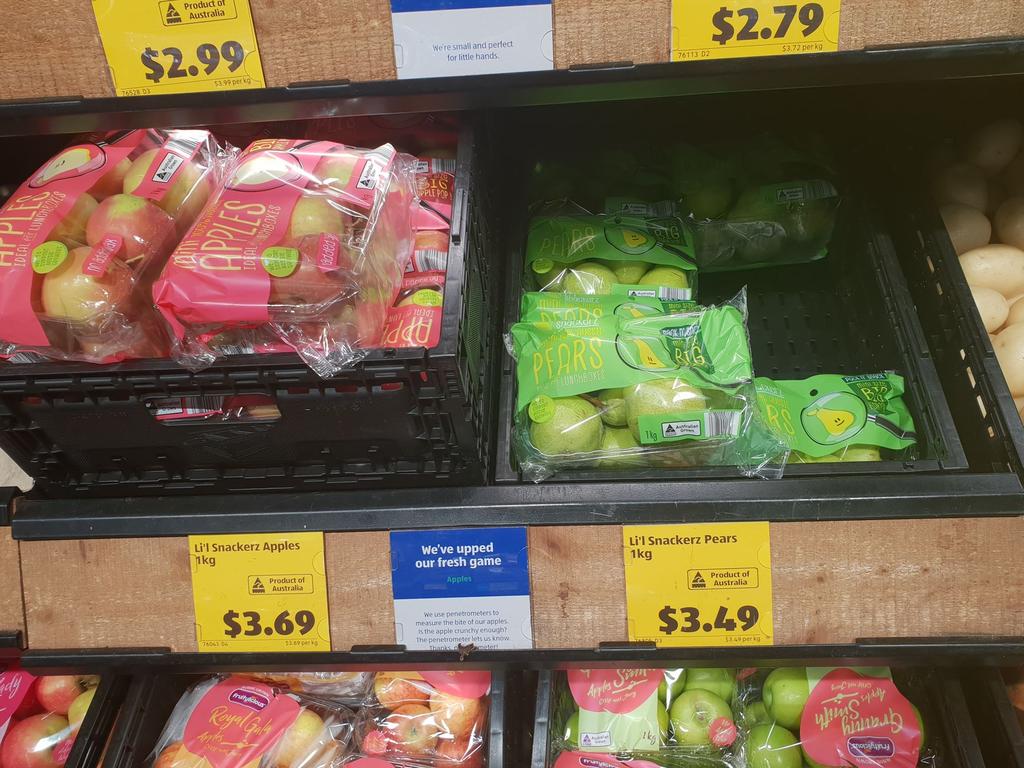 Various fruits were on display in plastic bags.