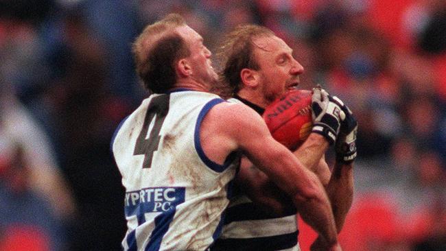 Gary Ablett gets a rare touch against Mick Martyn in the 1996 qualifying final.