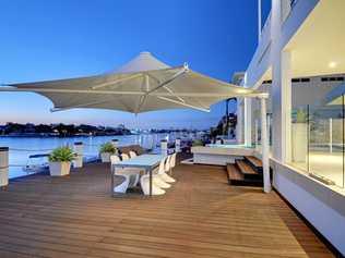 Outdoor entertaining area and deck of a waterfront Minyama home. Picture: Brad Filliponi