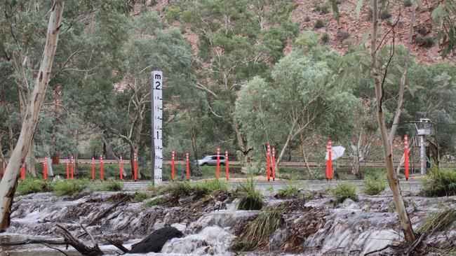 The Ross Highway Todd River crossing near Heavitree Gap, Alice Springs, April 2, 2025. Recent rain in Alice Springs triggered a flood alert warning residents the Todd river was running. Picture: Gera Kazakov