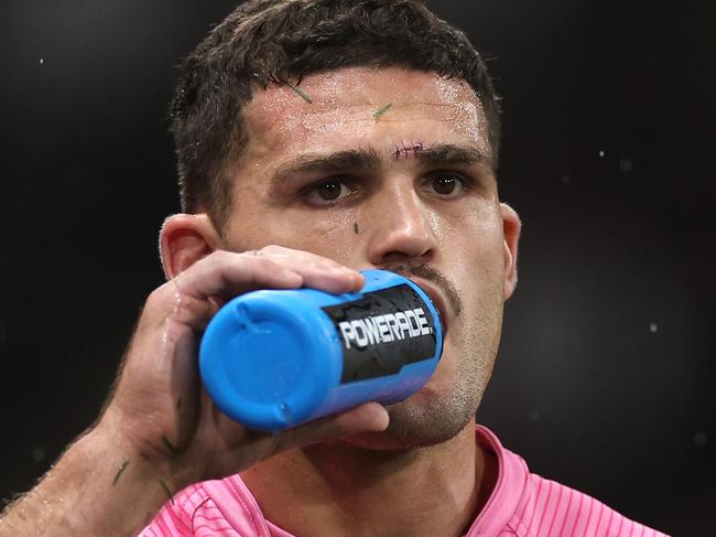 MELBOURNE, AUSTRALIA - MARCH 20: Nathan Cleary of the Panthers is assisted off the field by a trainer for a Head Injury Assessment (HIA) during the round three NRL match between the Melbourne Storm and Penrith Panthers at AAMI Park on March 20, 2025, in Melbourne, Australia. (Photo by Daniel Pockett/Getty Images)