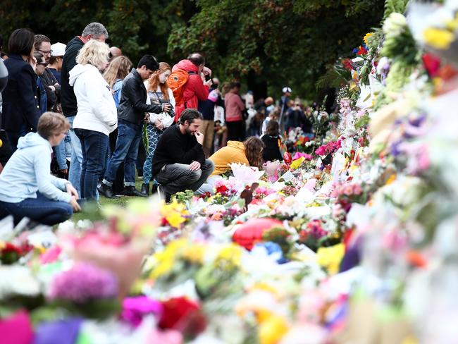 People lay flowers at the Botanic Gardens in Christchurch. Picture: Fiona Goodall/Getty