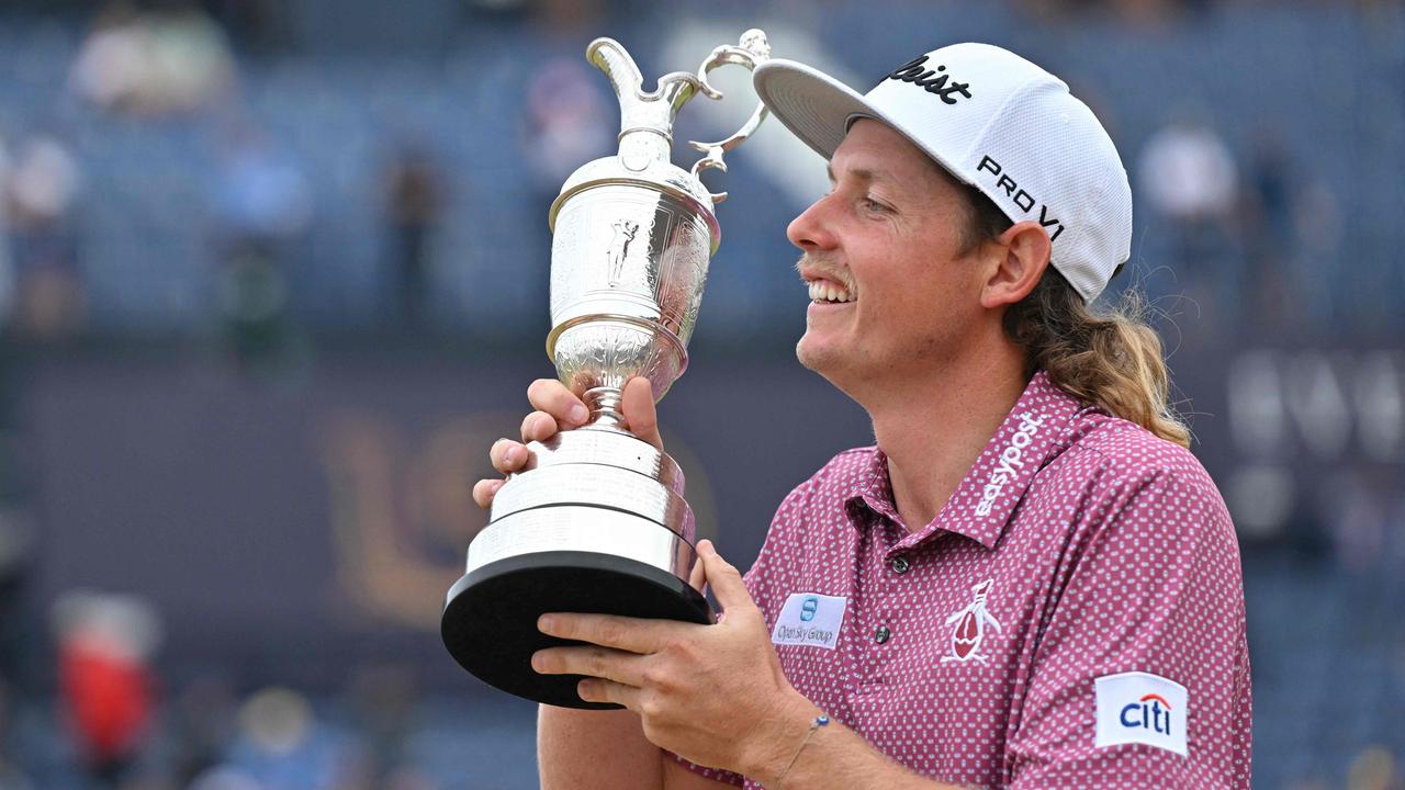 Never give up: Australia's Cameron Smith poses with the Claret Jug. Picture: AFP