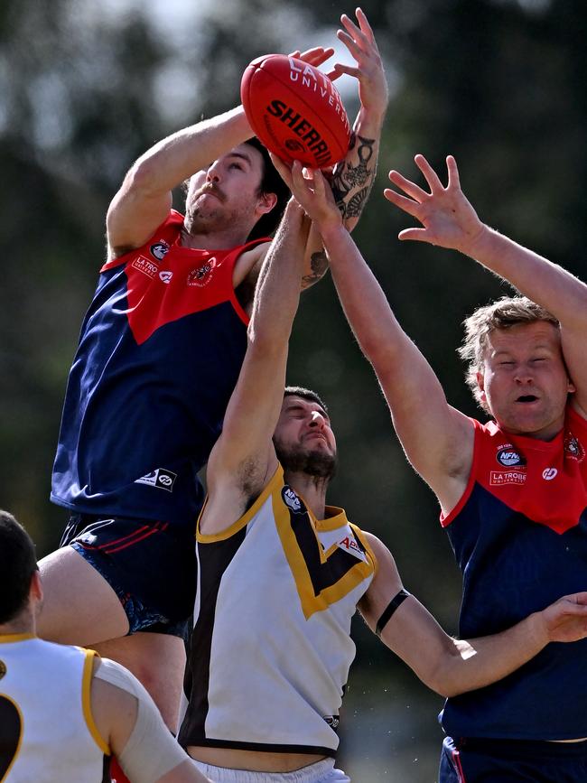 NFL: Diamond Creek’s Robby Noble soars above the pack. Picture: Andy Brownbill