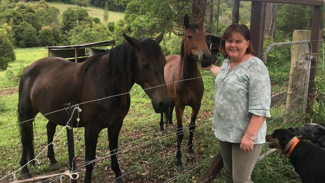 Karly Lane with her beloved horses at her 8-acre property near Macksville on the Mid-North Coast. Photo: Chris Knight.