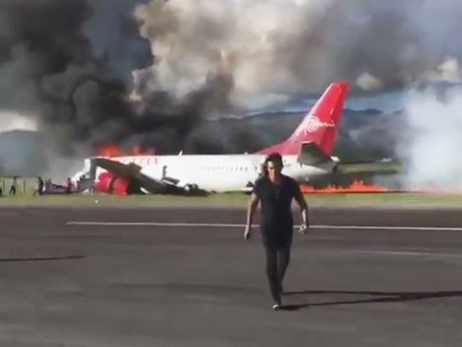 Plane bursts into flames after landing on runway in Peru. Picture: Twitter