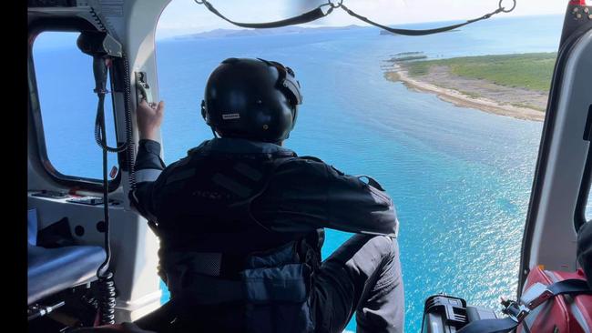 Rescue efforts underway to rush shark bite victim from Clack Island to Cairns Hospital. Picture: QAS