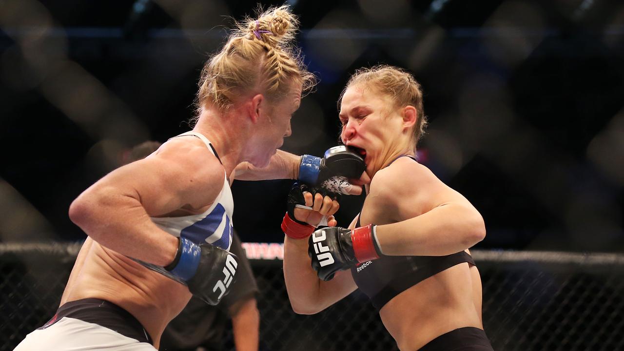 Ronda Rousey of the United States (R) and Holly Holm of the United States compete in their UFC women's bantamweight championship bout during the UFC 193 event at Etihad Stadium on November 15, 2015 in Melbourne, Australia. (Photo by Quinn Rooney/Getty Images)