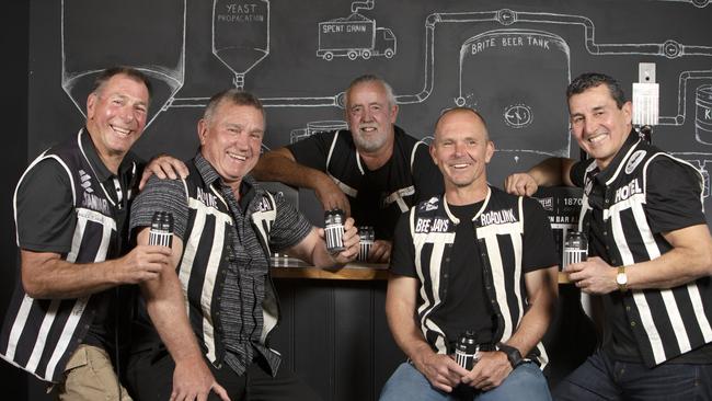 Pirate Life Brewing owner Michael “MC” Cameron (centre) sharing a Prison Bar Ale with past Port Adelaide players (L to R) Craig Ebert, Greg Phillips, Brayden Lyle and David Hutton. Picture: Emma Brasier