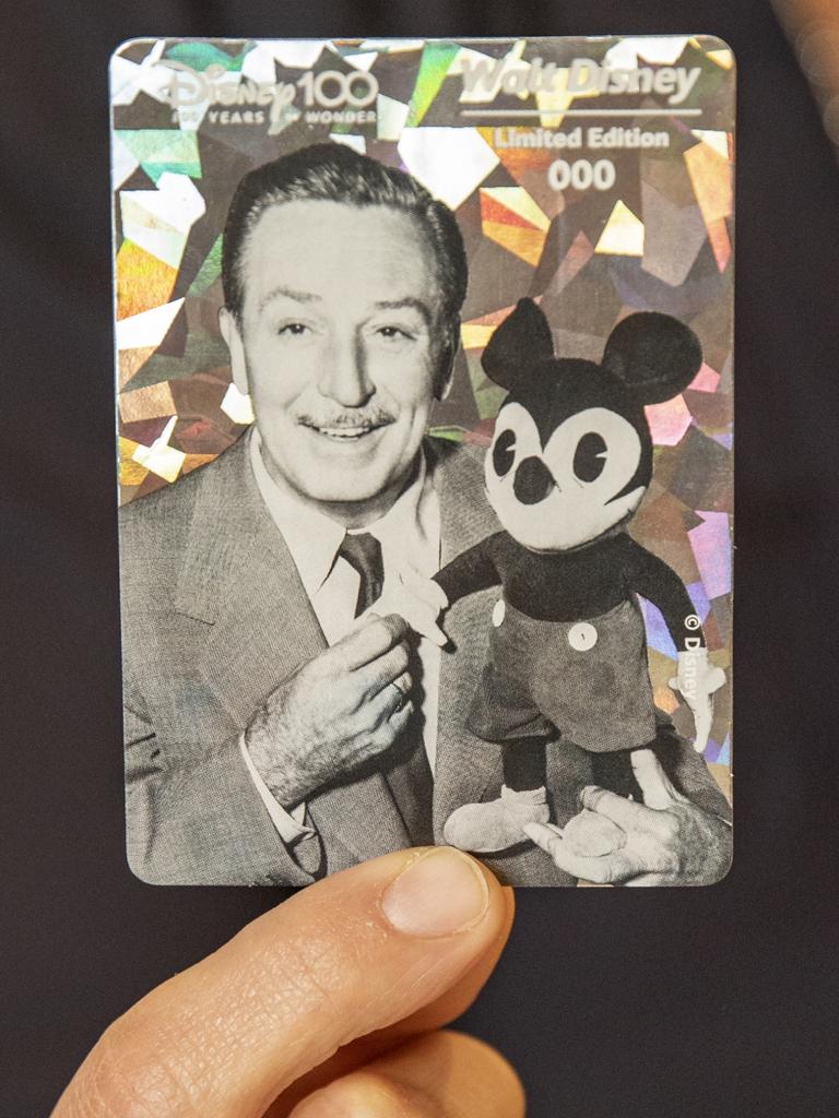 An 'ultra rare' holographic Walt Disney card has also been placed in the new Woolworth's Disney 100 Wonder collector card packs at random. Picture: Dallas Kilponen/Woolworths