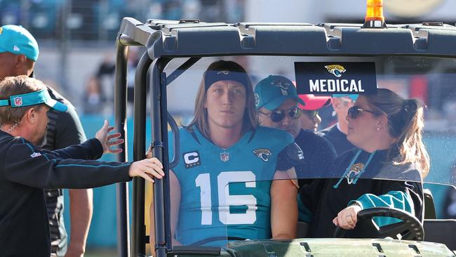 Quarterback Trevor Lawrence #16 of the Jacksonville Jaguars is taken off the field in a medical cart. Photo: Mike Carlson/Getty Images/AFP.