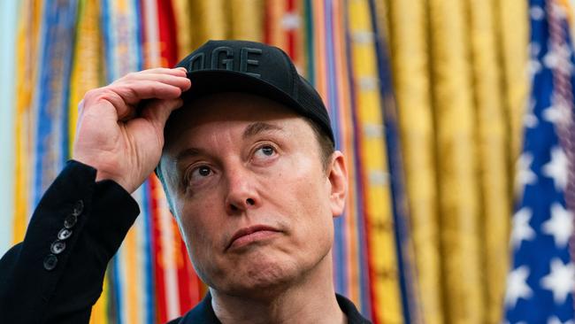 Elon Musk looks on during a news conference with Donald Trump in the Oval Office of the White House. Picture: AFP.