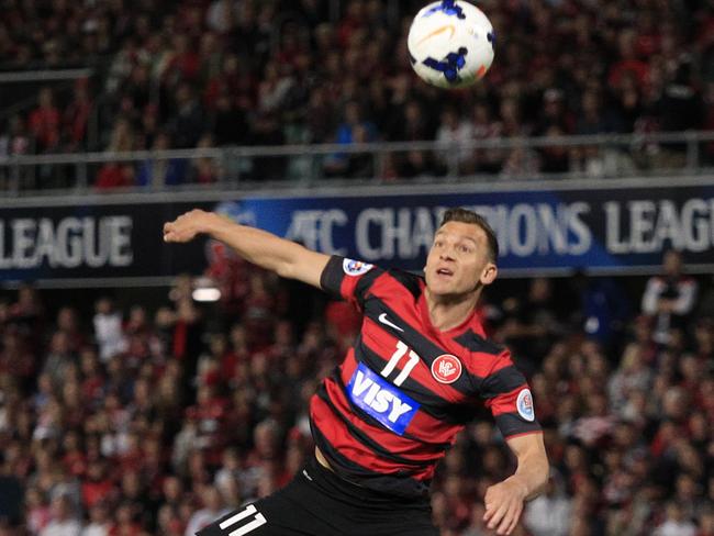 Brendon Santalab jumps for the ball against FC Seoul. (Mark Evans)