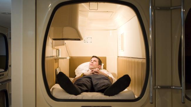 A businessman using a pod hotel in Japan. Picture: istock