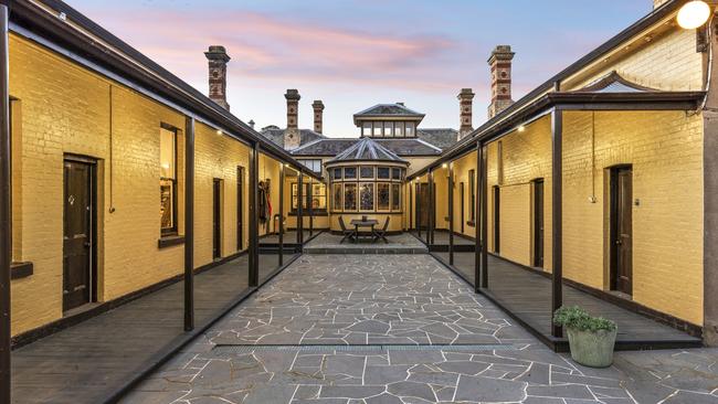 Several wings of the homestead wrap around a central courtyard.