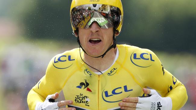 Britain's Geraint Thomas, wearing the overall leader's yellow jersey, celebrates after crossing the finish line of the twentieth stage of the Tour de France cycling race, an individual time trial over 31 kilometers (19.3 miles)with start in Saint-Pee-sur-Nivelle and finish in Espelette, France, Saturday July 28, 2018. (AP Photo/Christophe Ena )